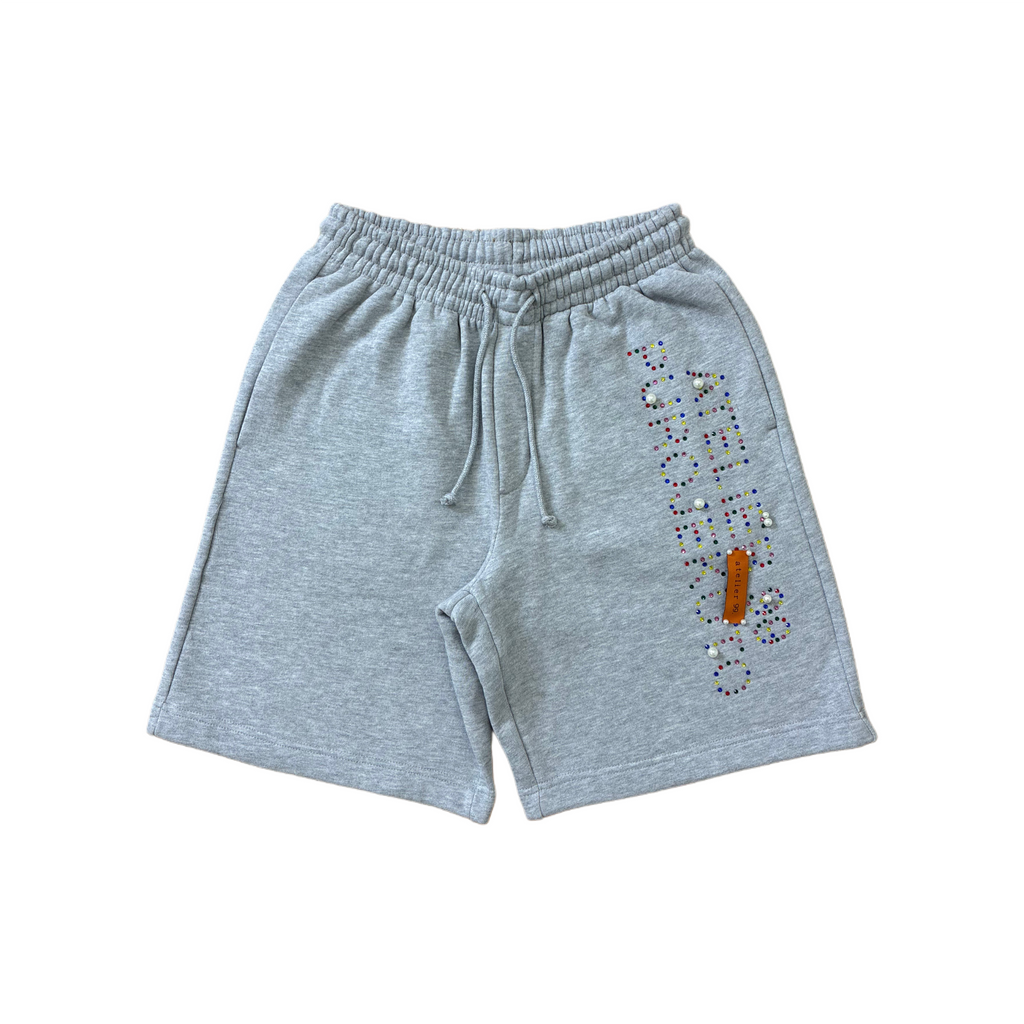 Gray 320 gsm short with colorful rhinestone design, pearls and signature atelier 99 woven level in orange, all apply by hand in our workshop.